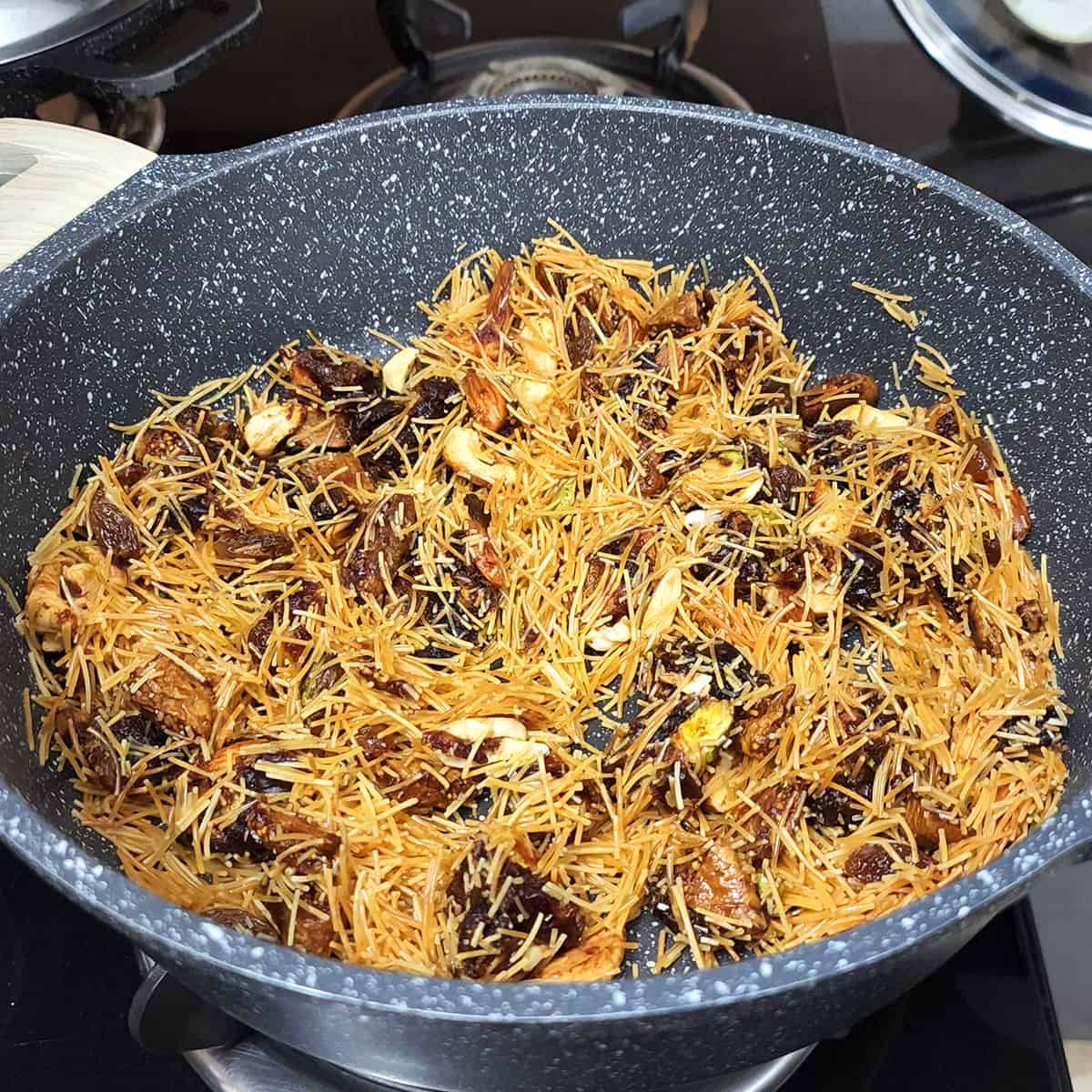 Sauté vermicelli (seviyan), dried fruits and nuts. 