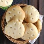 Quick and easy homemade ciabatta rolls in a brown bamboo bread basket.
