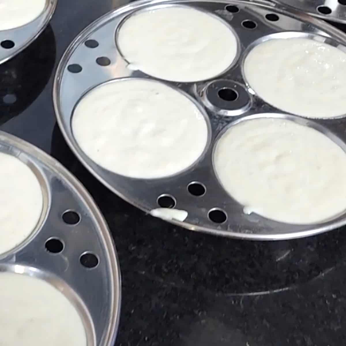 All idli plates with batter. 