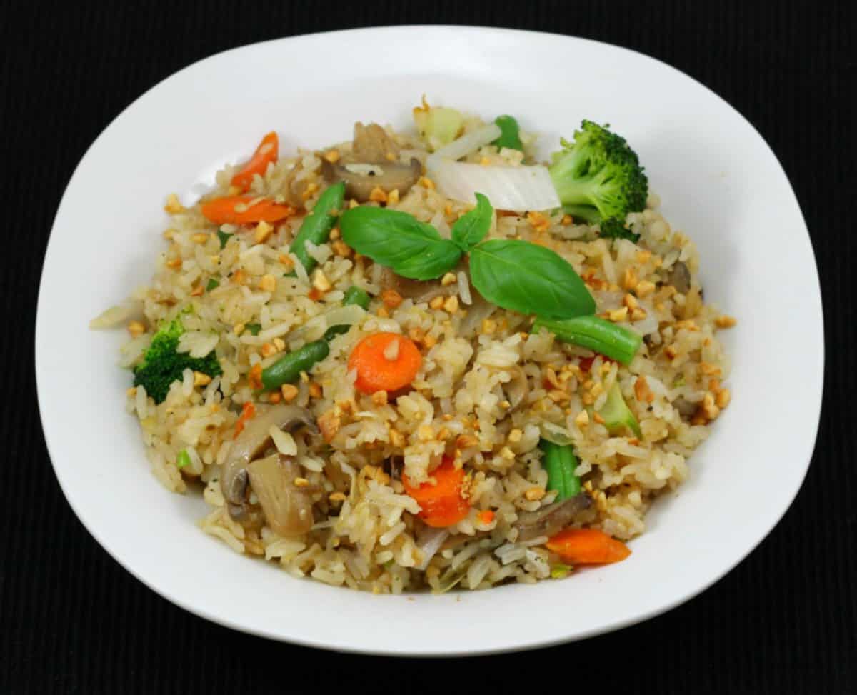 Thai restaurant-style Khao Pad or Khao Phat with Veggies served in a white plate.