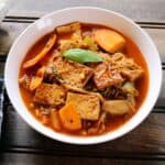 Thai Holy Basil Stir Fry with Tofu or Pad Kra Pao served in a white bowl.