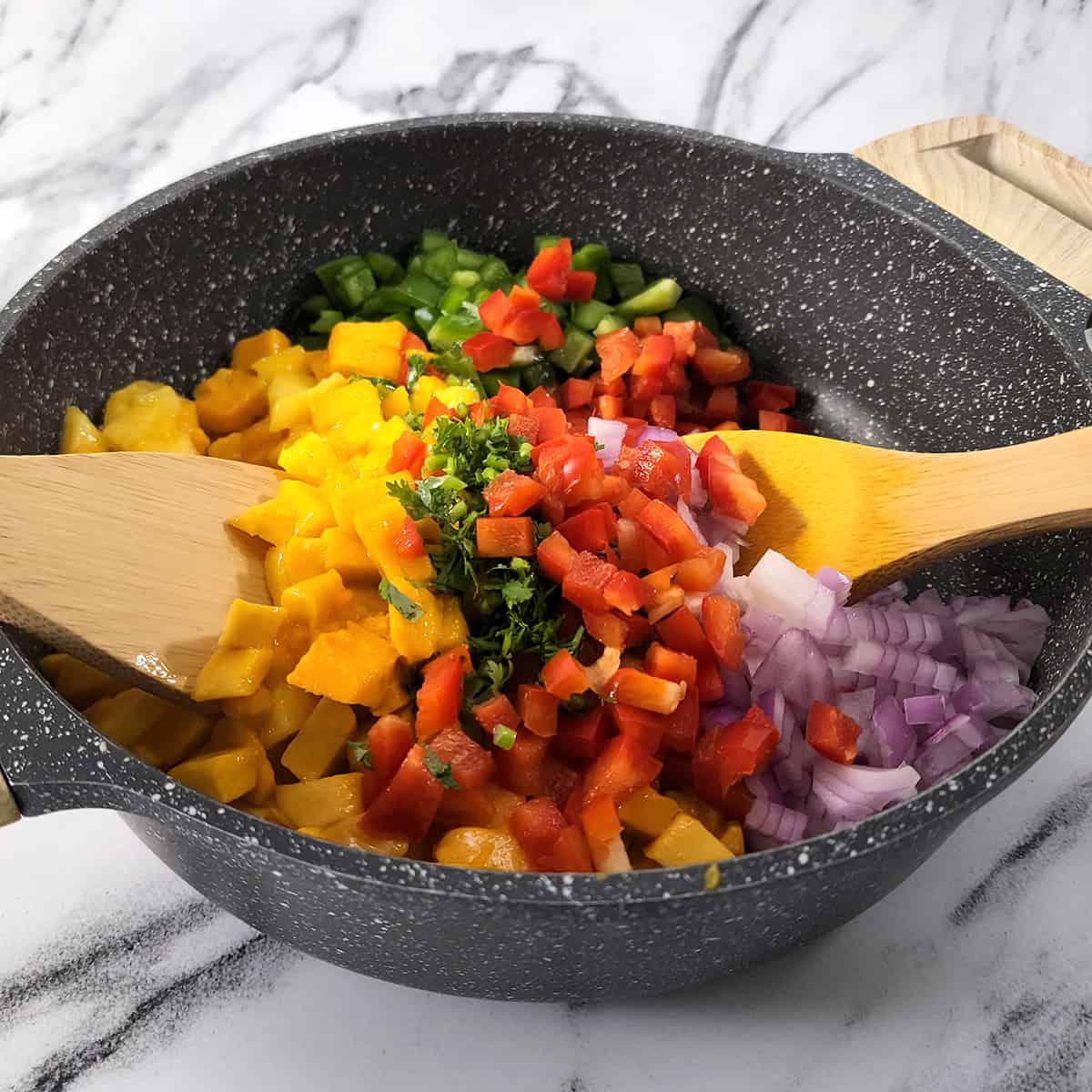 Combine all the ingredients for salsa using ladle.