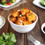 Delicious Honey Sriracha Tofu served in a white bowl.
