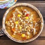 Easy One-Pot Barley Soup with Vegetables served in a ceramic soup mug.