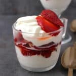 Easy and Delicious Strawberries and Cream served in a dessert glass.
