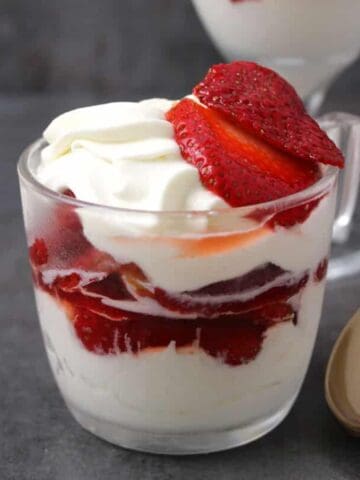 Easy and Delicious Strawberries and Cream served in a dessert glass.