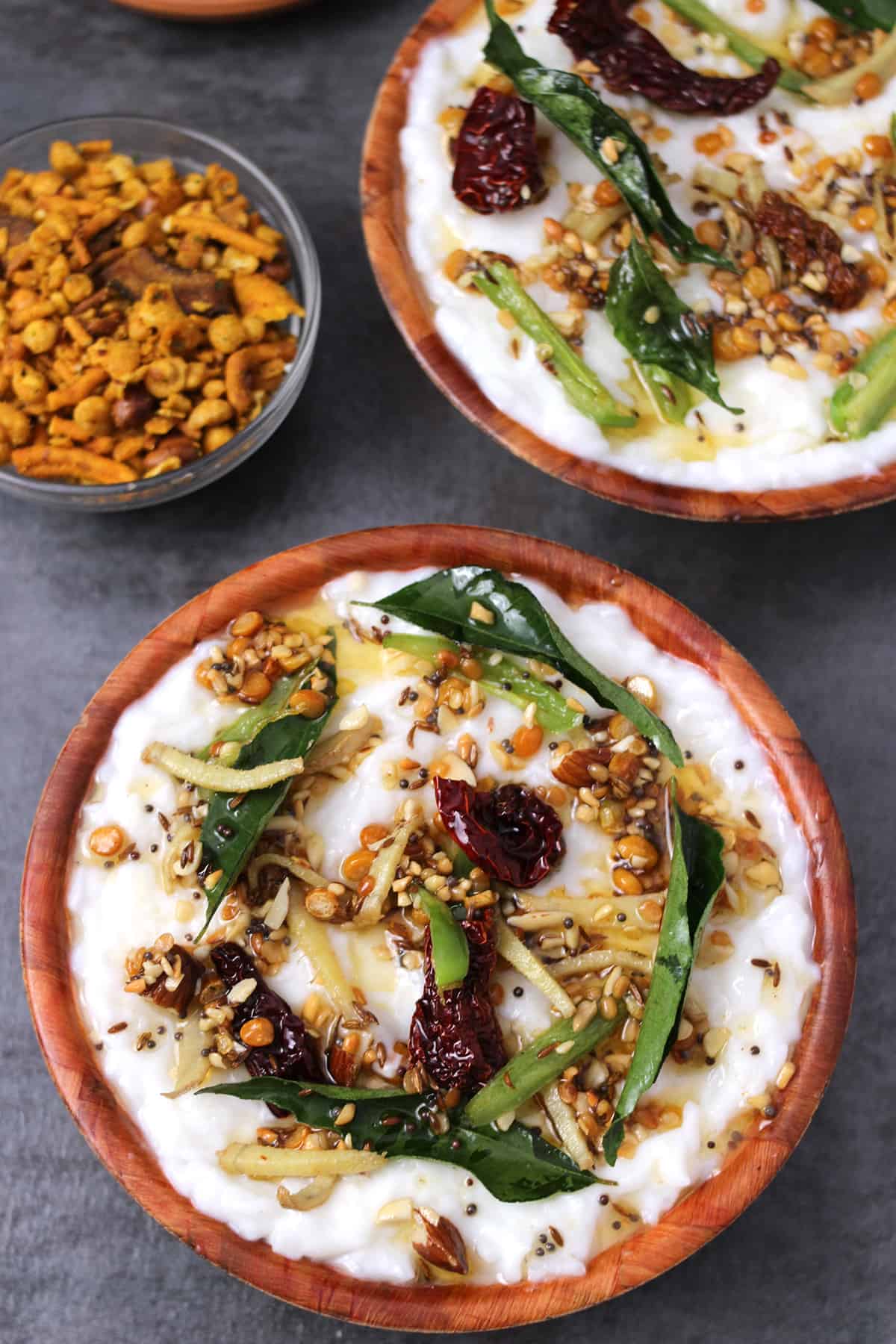 Best Indian curd rice (thayir sadam or yogurt rice) in a serving bowl with tadka or tempering. 