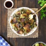 Perfectly roasted and crispy Brussels Sprouts in a plate.