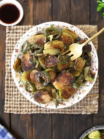 Perfectly roasted and crispy Brussels Sprouts in a plate.