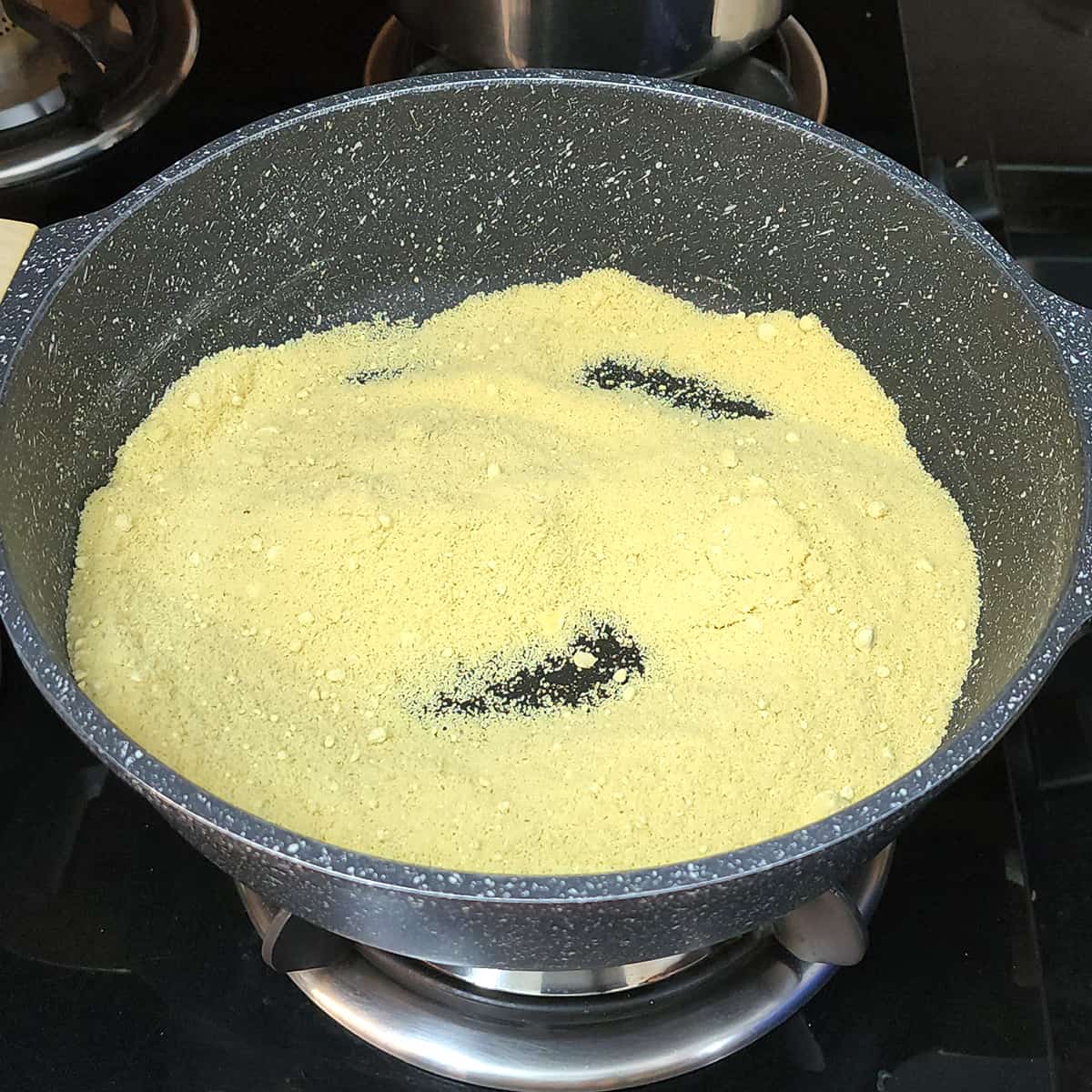 Roast besan (chickpea flour).