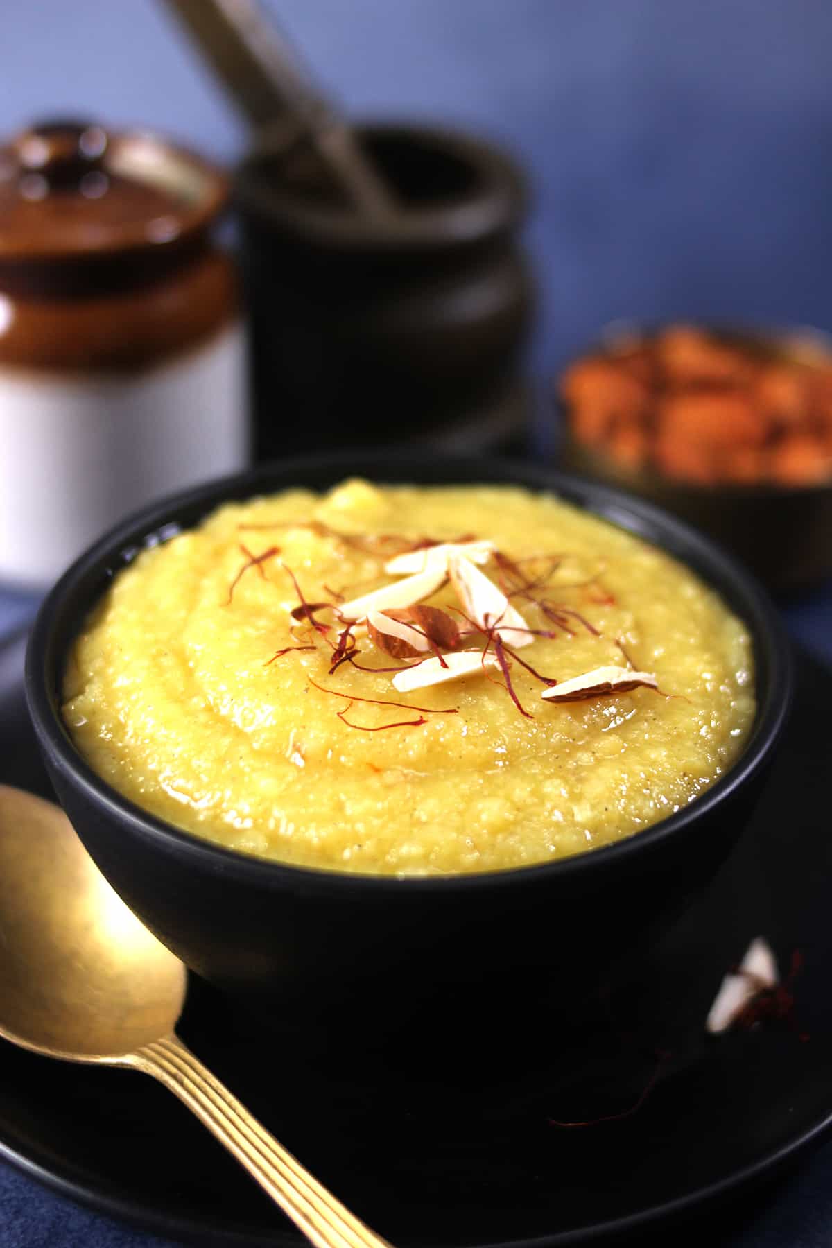 Indian dessert badam halwa in a bowl. Popular and easy, healthy almond halwa sweet. 