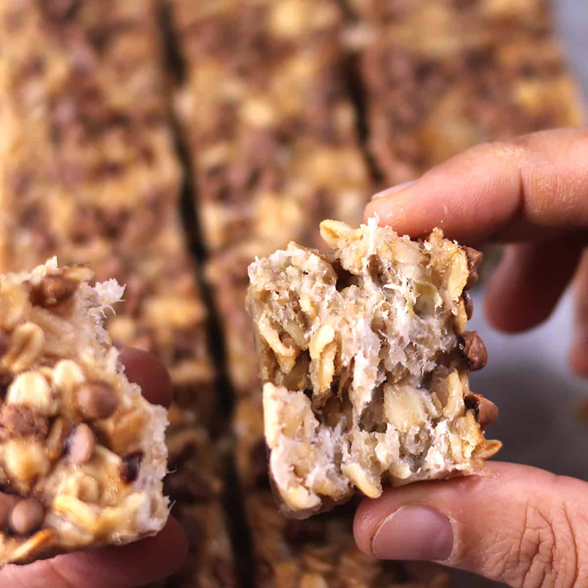 showing the soft and chewy texture of baked homemade banana oatmeal breakfast bars recipe. 