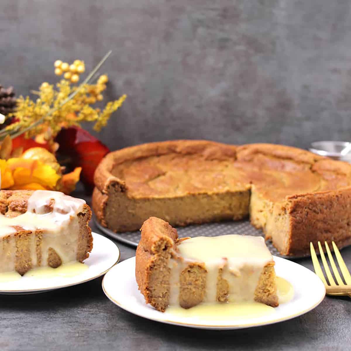 Two slices of rich and classic old fashioned persimmon apple pudding cake on a serving plate. 