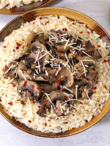 Mushroom risotto. Classic, traditional, creamy vegetarian risotto recipe with arborio rice.