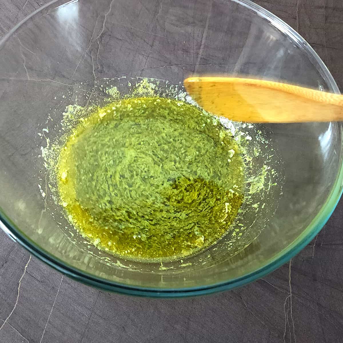 Mix melted butter with garlic herb lemon mixture. 