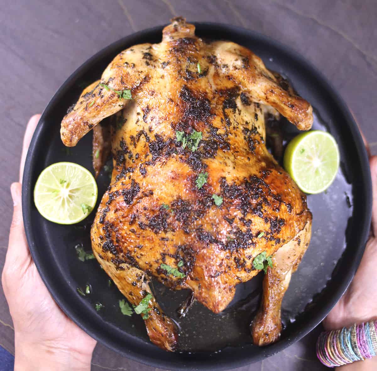 Whole roasted chicken with crispy salty skin, juicy and tender pieces for perfect chicken dinner. 