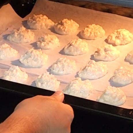 Bake the coconut macaroons. 