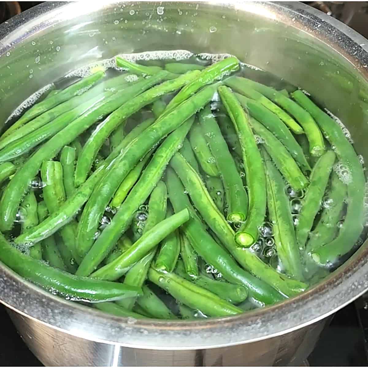 Blanch the green beans. 