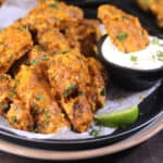 Crispy garlic chicken wings | fried chicken wings tossed in garlic butter sauce. Best appetizer.