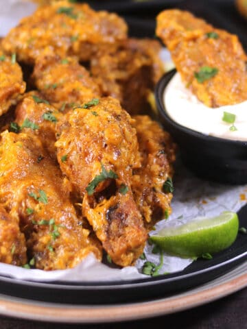 Crispy garlic chicken wings | fried chicken wings tossed in garlic butter sauce. Best appetizer.
