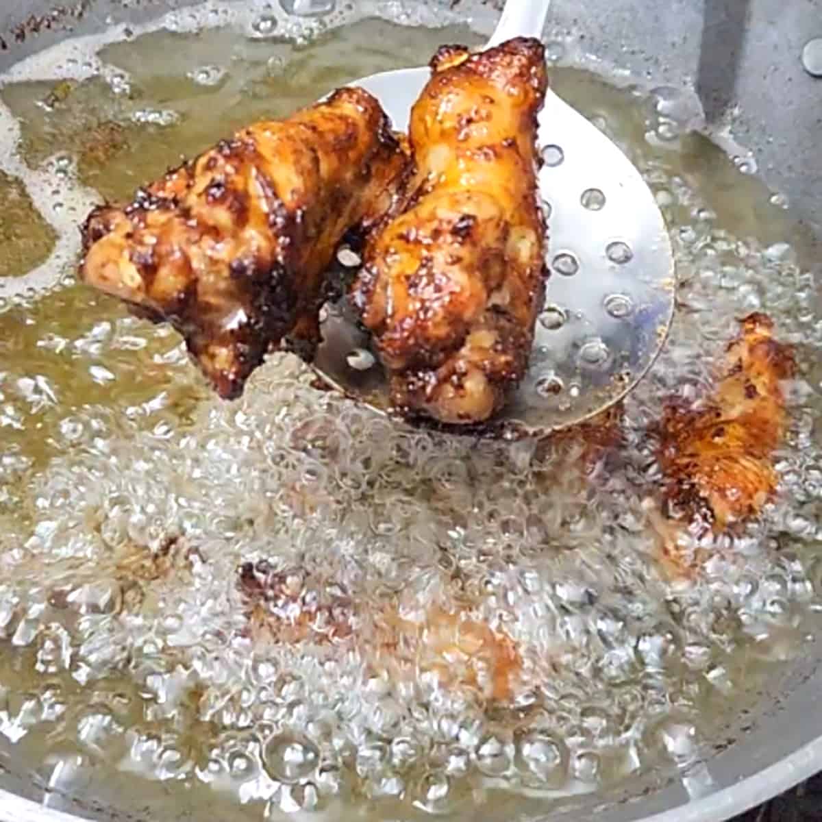 Fry until chicken wings become crisp and tender inside. 