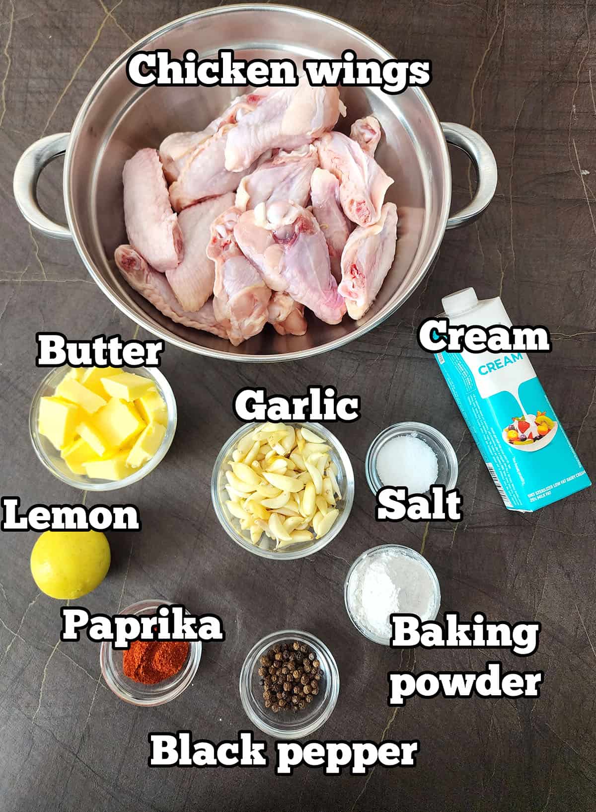 Ingredients used to make crispy chicken wings with creamy garlic butter sauce. 