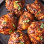 Best oven-baked chicken thighs recipe that is juicy and tender with a crispy exterior for dinner.