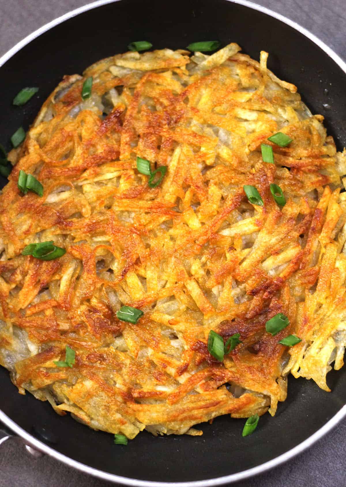 Potato Rosti - Pan fried crispy potato side dish recipe for breakfast, snack, dinner.