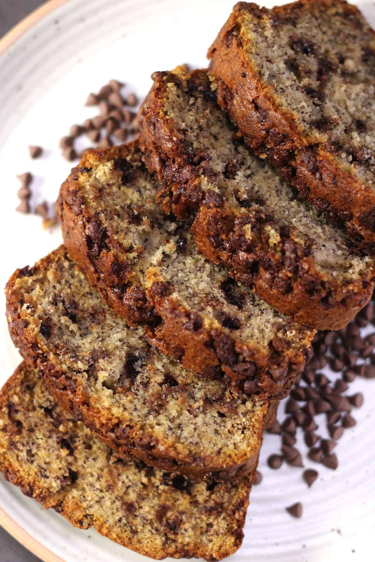 Slices of homemade Moist chocolate chip banana bread recipe - Best holiday bread recipe idea.
