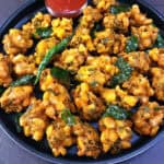 Crispy corn pakoda (corn fritters) - Evening tea time snack or party appetizer and finger food.