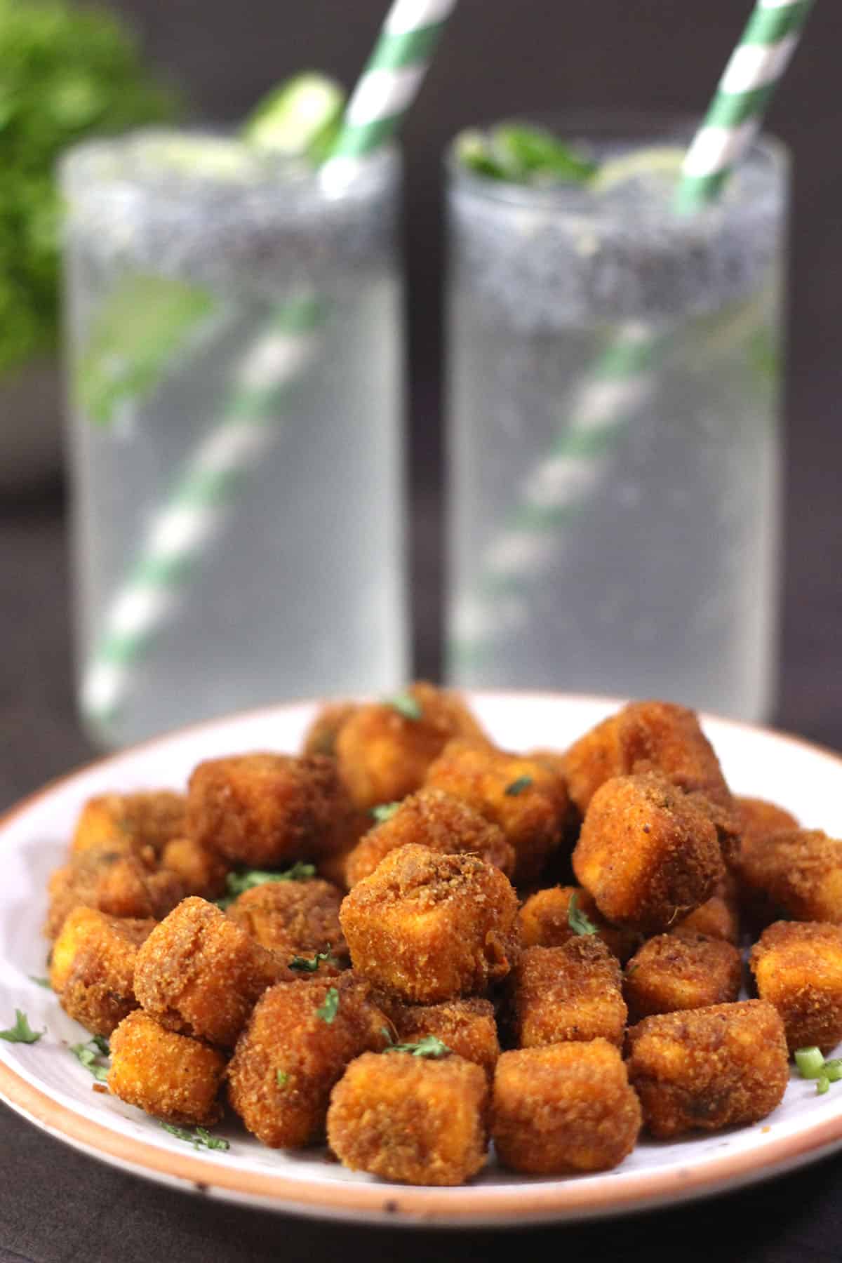 Paneer nuggets or popcorn served with spicy lemonade or kulukki sarbath.