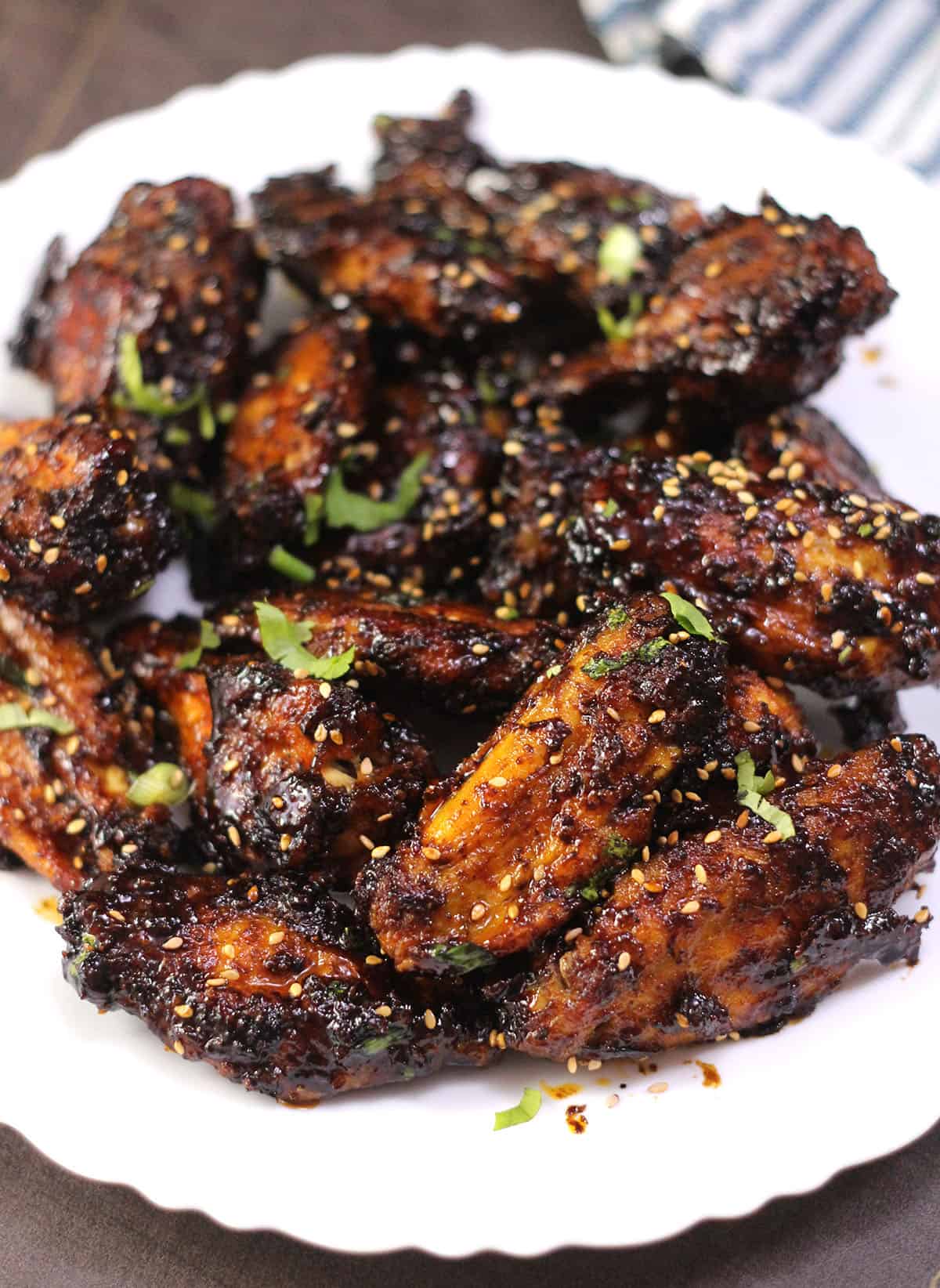 Crispy oven baked Asian style chicken wings with sticky soy sauce.