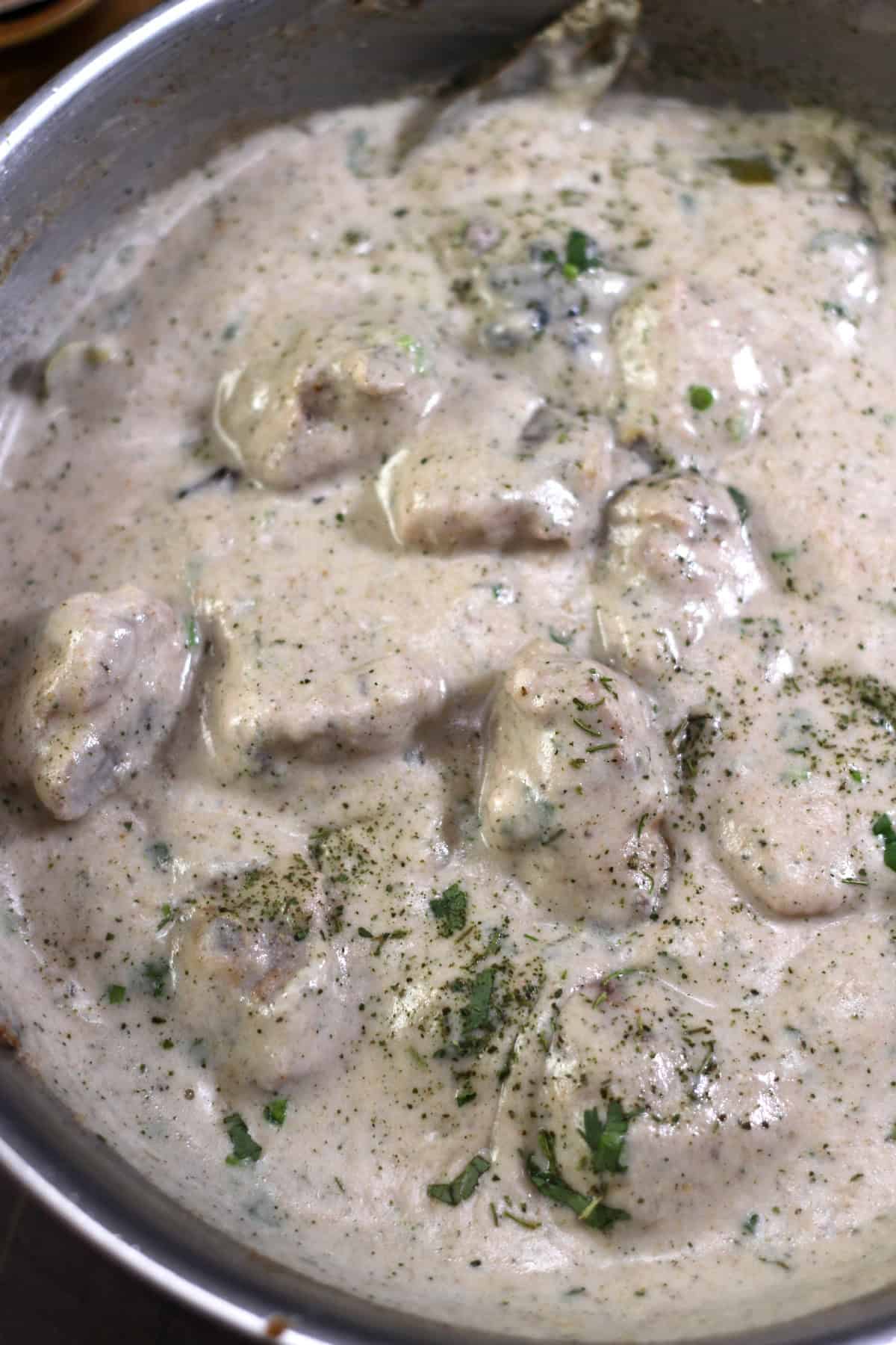 Chicken in creamy white gravy. Restaurant style Indian malai chicken recipe.