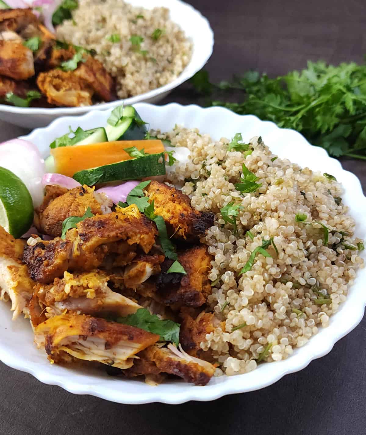 Shredded chicken, cooked quinoa in a salad bowl. Meal-prep ideas.