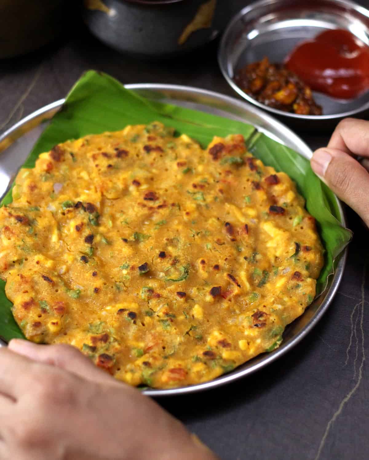 Besan chilla served with pickle or green chutney. Popular Indian recipe.
