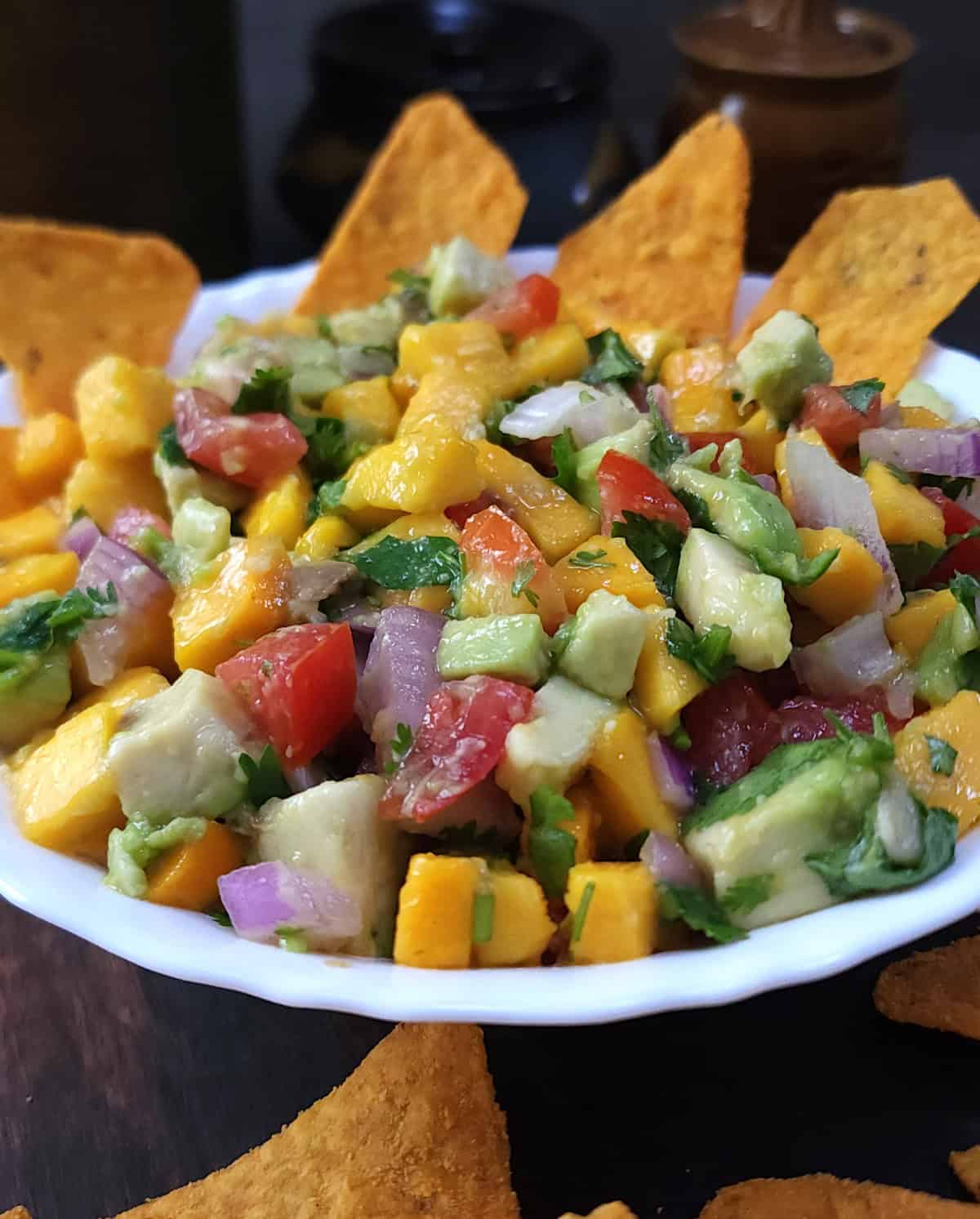 Best salsa recipe with mango and avocado served with tortilla chips.