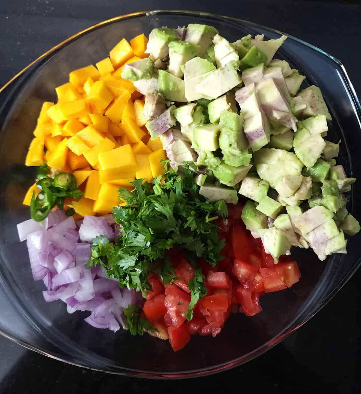 Ingredients to make fresh mango salsa with avocado - Quick summer and BBQ recipes.