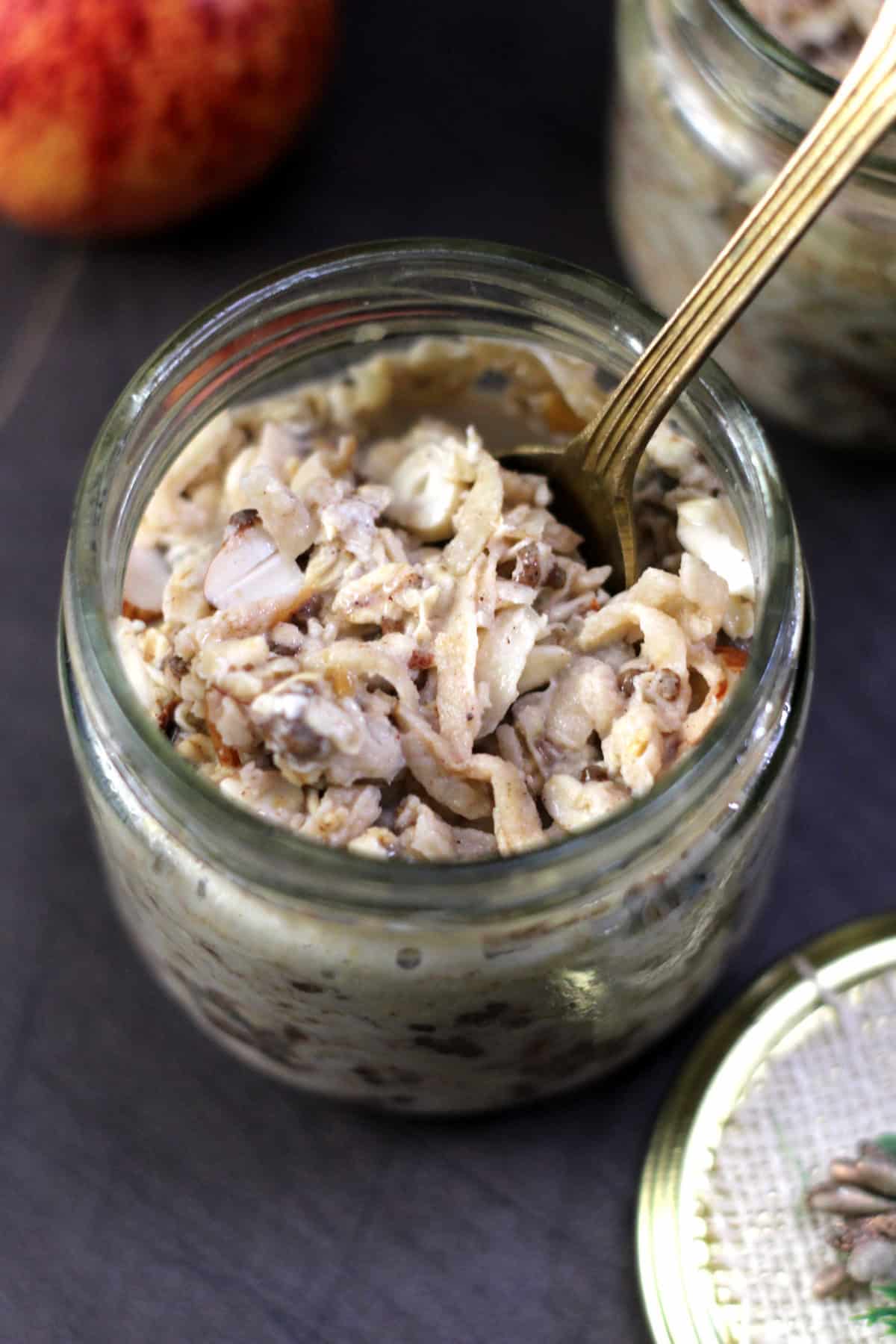 Overnight oats recipe with grated apple, cinnamon, chia seeds and milk.