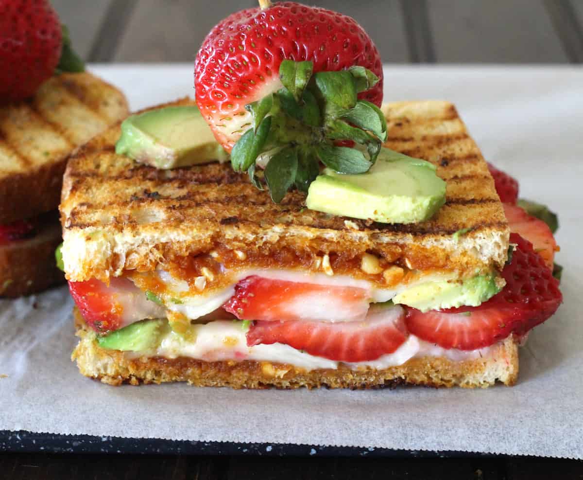 Unique grilled cheese sandwich recipe with avocado, strawberry and nut butter. Quick meal idea.