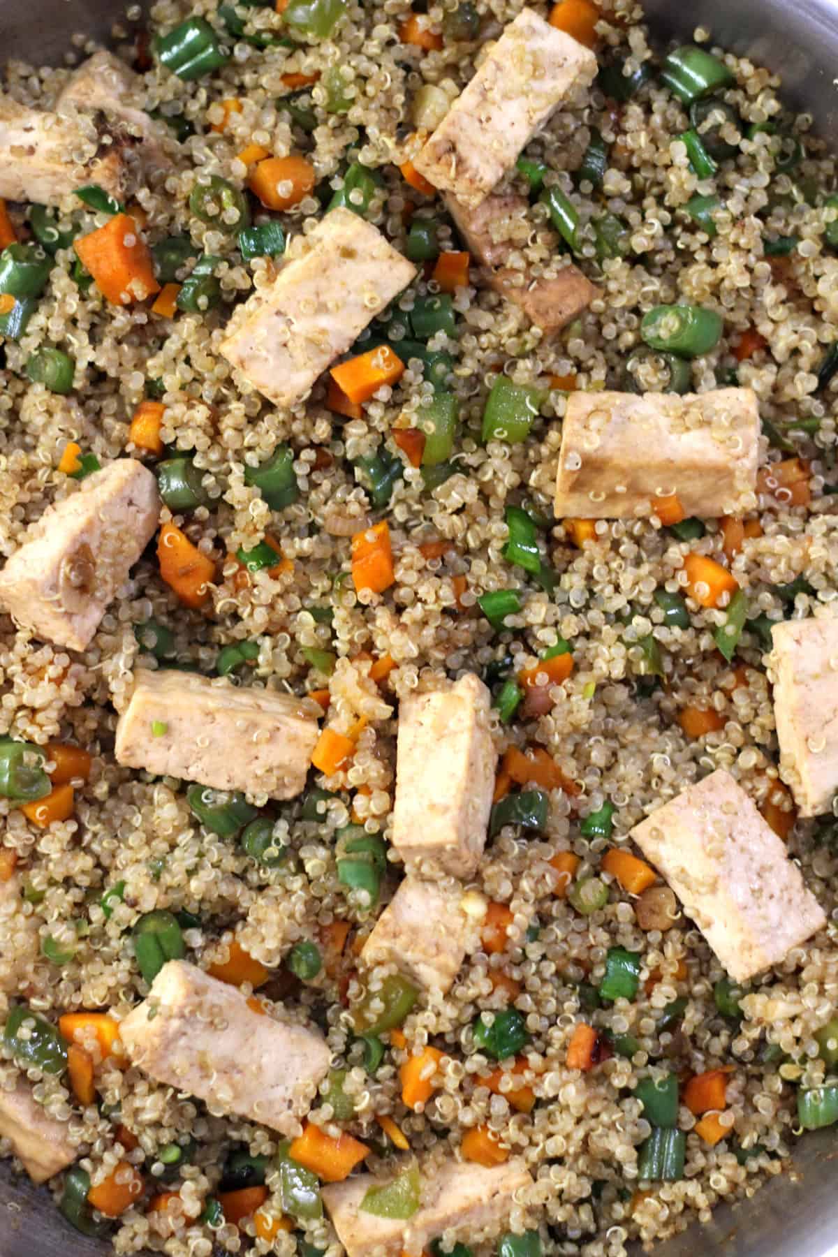 Fried quinoa with tofu, vegetables and Asian seasonings.